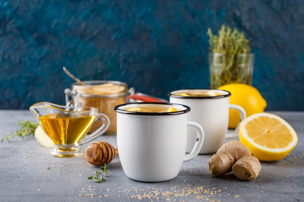 Premium Photo | Cups of ginger tea with honey and lemon