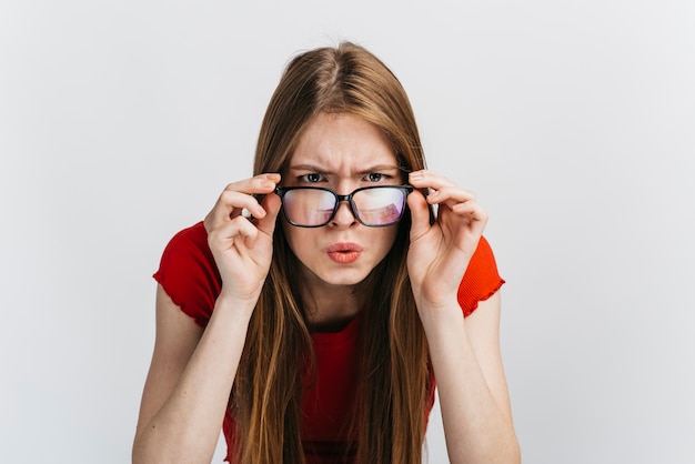Curious woman with glasses staring Premium Photo