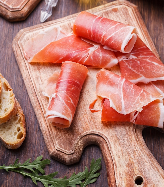 Premium Photo | Curled slices of prosciutto