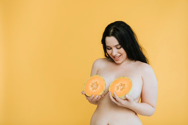 626px x 417px - Diverse curvy nude women holding fruits over their breasts ...