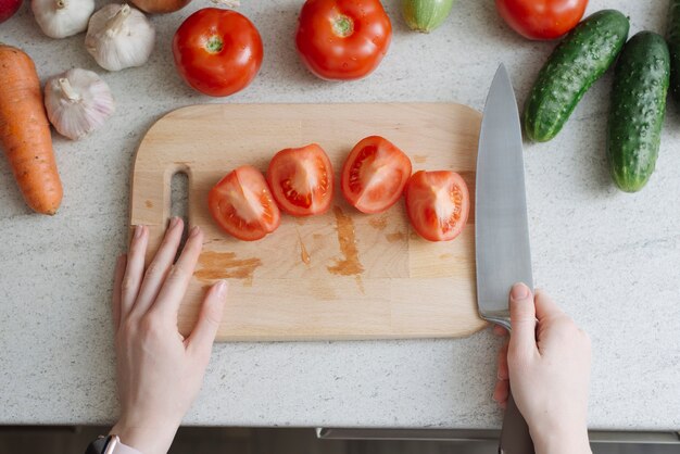 Cut tomatoes on board Free Photo