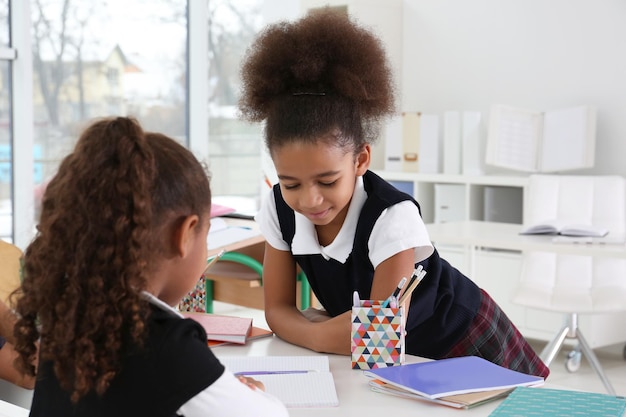 Premium Photo | Cute african-american girls in classroom