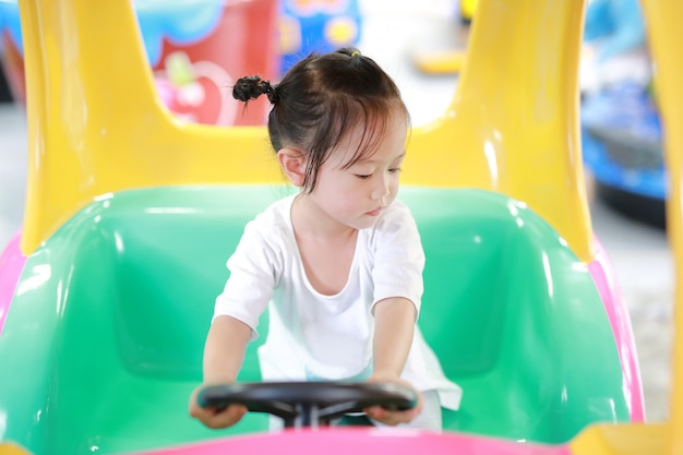 Cute Asian Baby Play In Toy Car Play Ground Photo Premium Download
