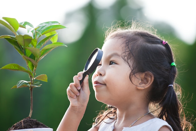 Premium Photo | Cute asian little child girl looking through a ...