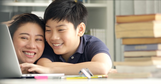 Cute Asian Mother Helping Your Son Doing Your Homework Premium Photo