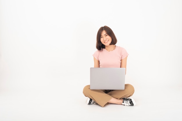 Premium Photo Cute Asian Teen Woman Is Working With Computer On White Wall