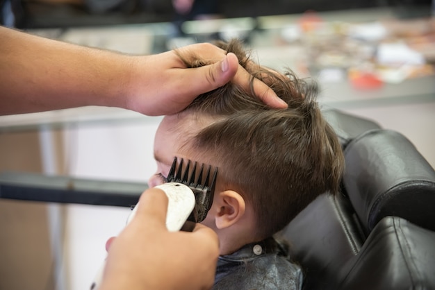 Premium Photo | Cute baby boy toddler - cutting hair