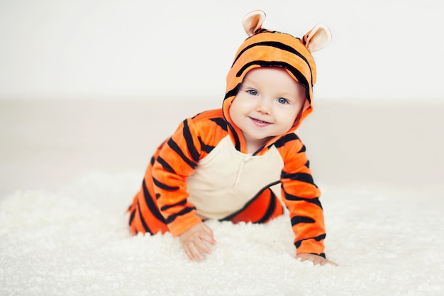 Premium Photo Cute Baby Dressed In A Bright Tiger