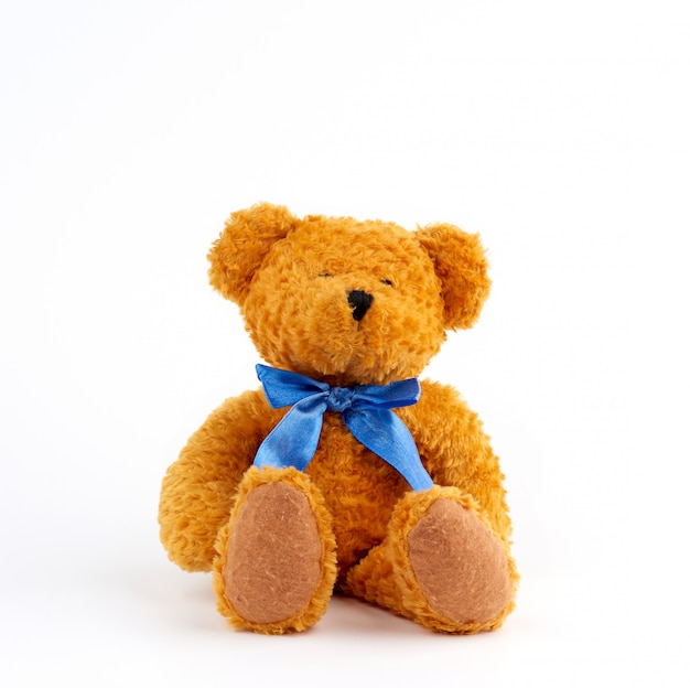 brown teddy bear with bow tie