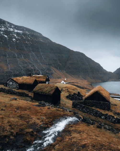 Premium Photo | Cute cabin on the hill in saksun village, denmark