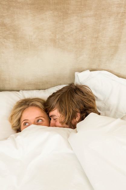 Cute Couple Cuddling In Their Bed Photo Premium Download