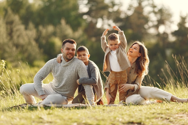 Cute family playing in a summer field Free Photo