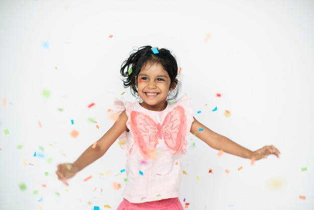 Premium Photo | Cute girl dancing in confetti