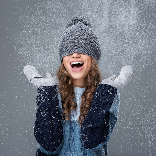 Cute girl with snowflakes having a good time Free Photo