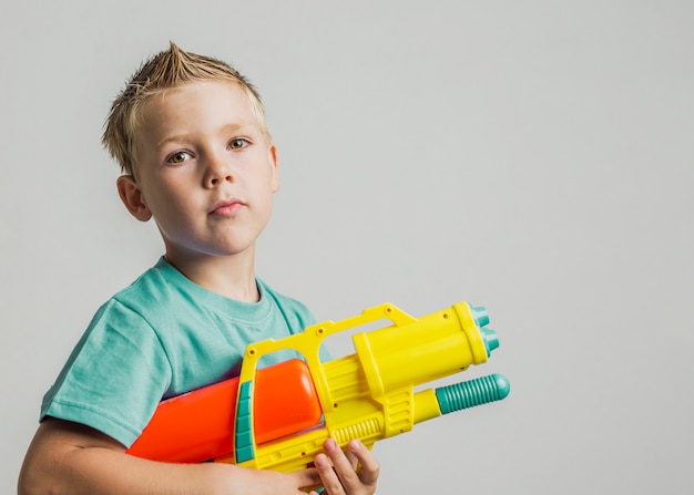 kid with water gun