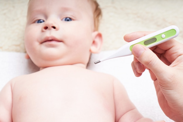 kid with thermometer