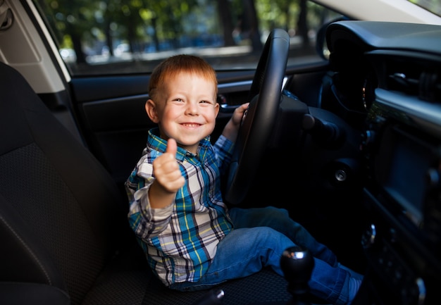 little boy car driving