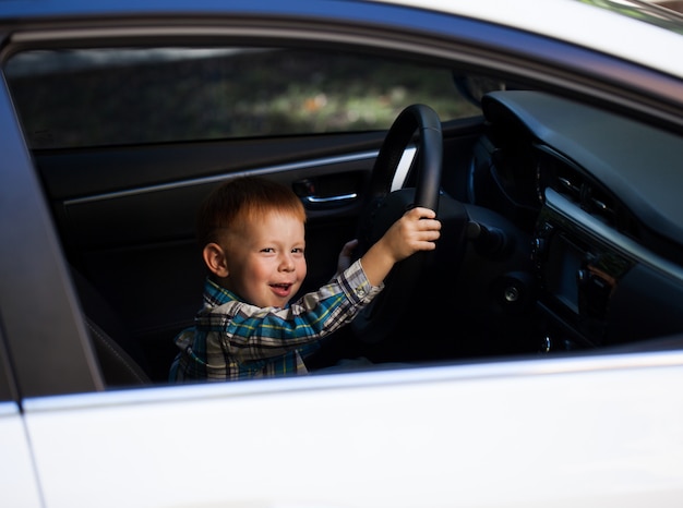 little boy car driving