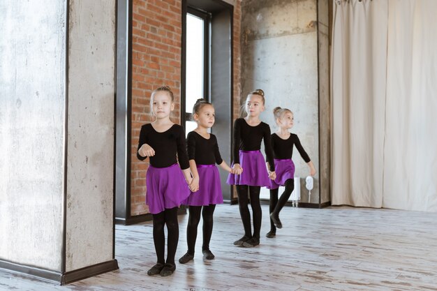 Premium Photo | Cute little kids dancers on dance studio