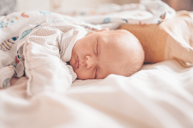 Premium Photo | Cute Newborn Infant Baby Boy Sleeping In Crib. Healthy ...