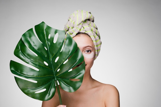 premium-photo-cute-smiling-girl-with-a-towel-on-her-head-holding-a