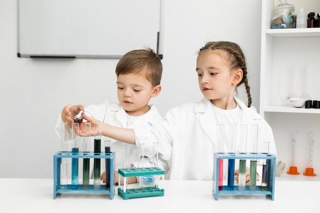 Free Photo | Cute young kids scientists doing experiments