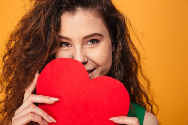 Premium Photo Cute young lady holding heart  