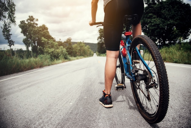 Cyclist man racing bike outdoor Free Photo