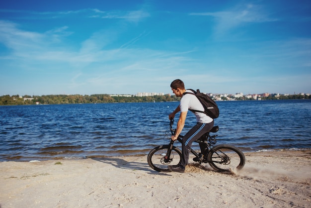 riding a bike on the beach