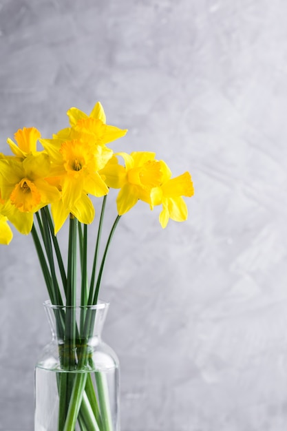 Premium Photo | Daffodils in a glass vase