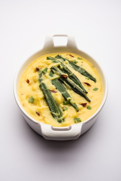 Premium Photo | Dahi bhindi or okra in yogurt gravy, served in a bowl ...