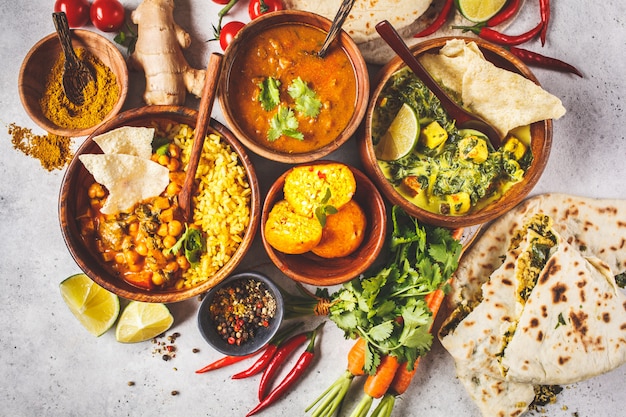 Premium Photo | Dal, palak paneer, curry, rice, chapati, chutney in ...