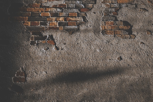 Free Photo | Damaged cement wall with bricks