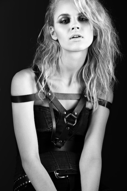 Premium Photo | Daring girl model in black leather dress, style of rock