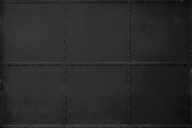 暗い黒い金属のテクスチャ背景 倉庫のドアは黒鉄のドアです プレミアム写真