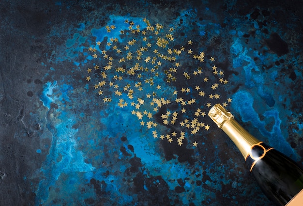 dark-blue-background-bottle-champagne-go