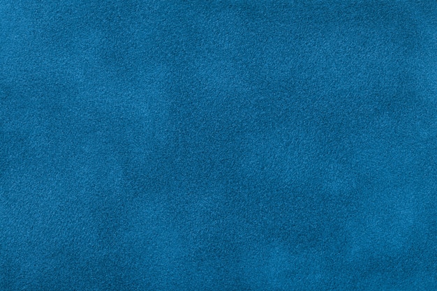 Premium Photo | Dark blue matte background of suede fabric, closeup.