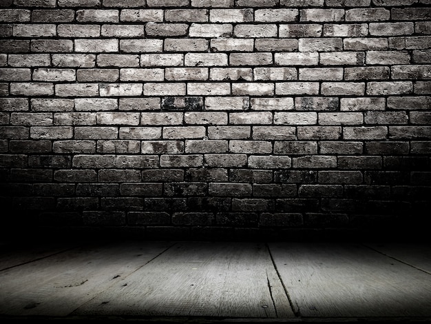 Premium Photo | Dark room with wooden floor and brick wall background.