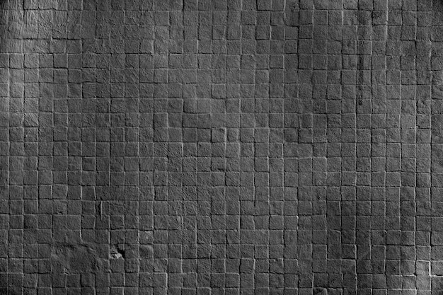 Free Photo | Dark square brick wall