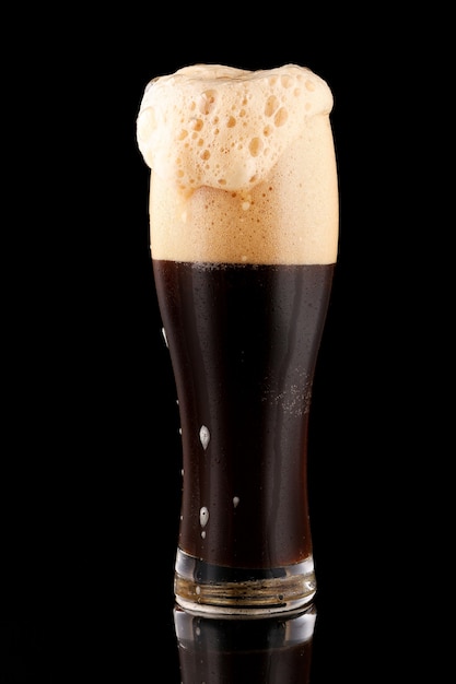 Premium Photo | Dark unfiltered beer with foam