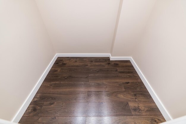 Premium Photo | Dark wood floor and light walls empty room