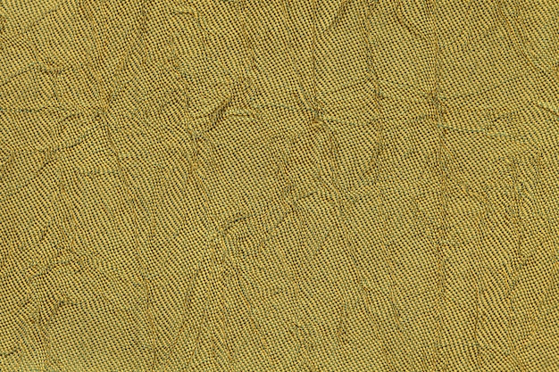 Premium Photo | Dark yellow wavy a textile material. fabric with fold