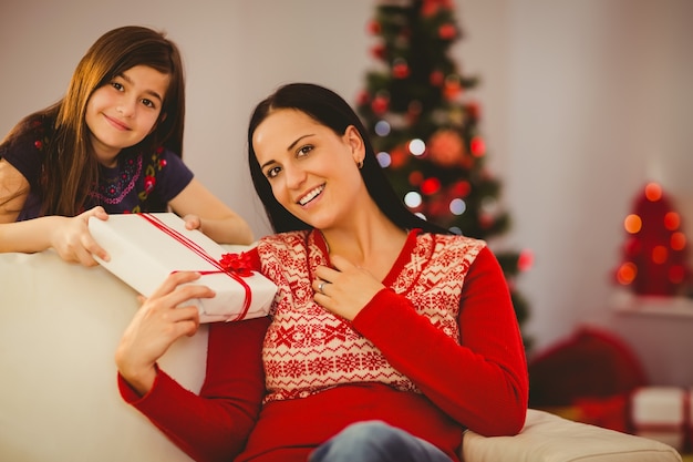 Premium Photo Daughter Giving Her Mother A Christmas Present