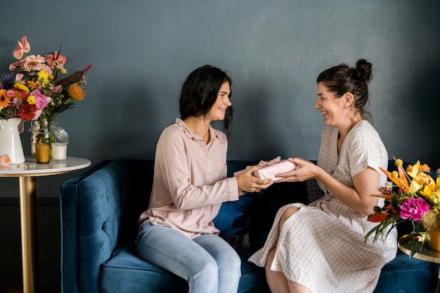 Premium Photo Daughter Surprising Her Mother With A Present