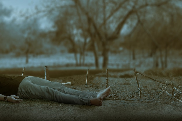 Premium Photo | The dead man lying down on the ground