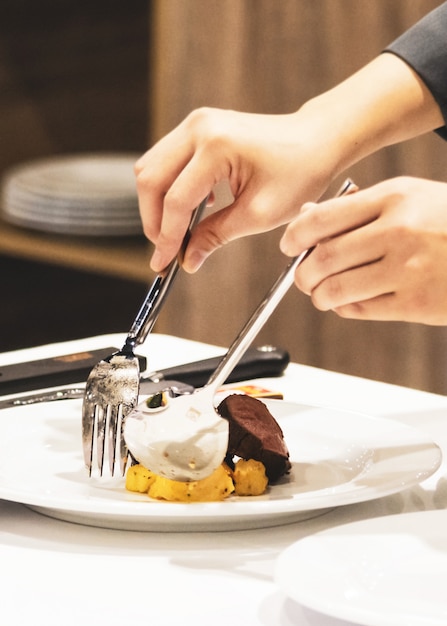 Decorate Food Serving Dishes To The Table In The Restaurant