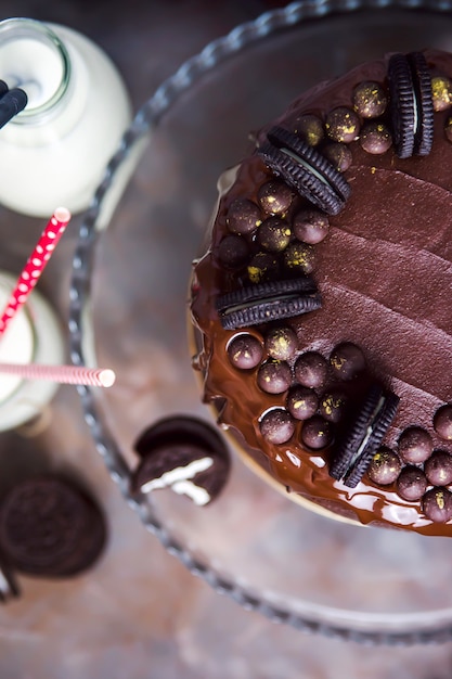 Premium Photo | Decoration on a chocolate cake of cookies and gold ...