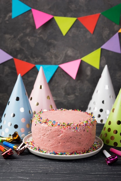 Decoration With Pink Cake And Party Hats Free Photo