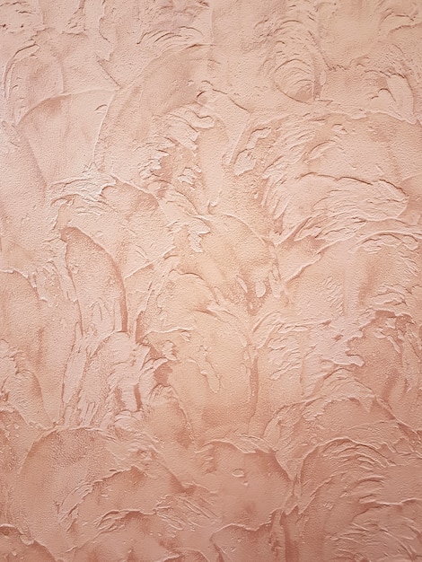 Premium Photo | Decorative golden plaster texture on the wall