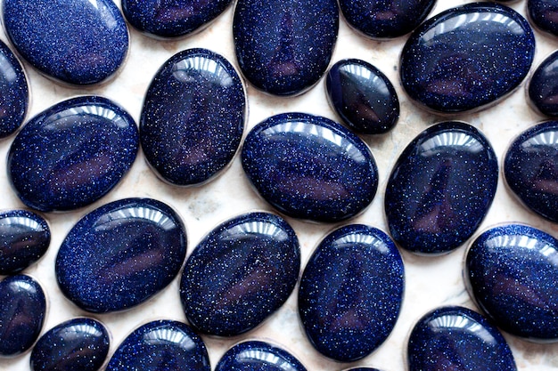 Premium Photo | Decorative oval blue stones collection as a background ...